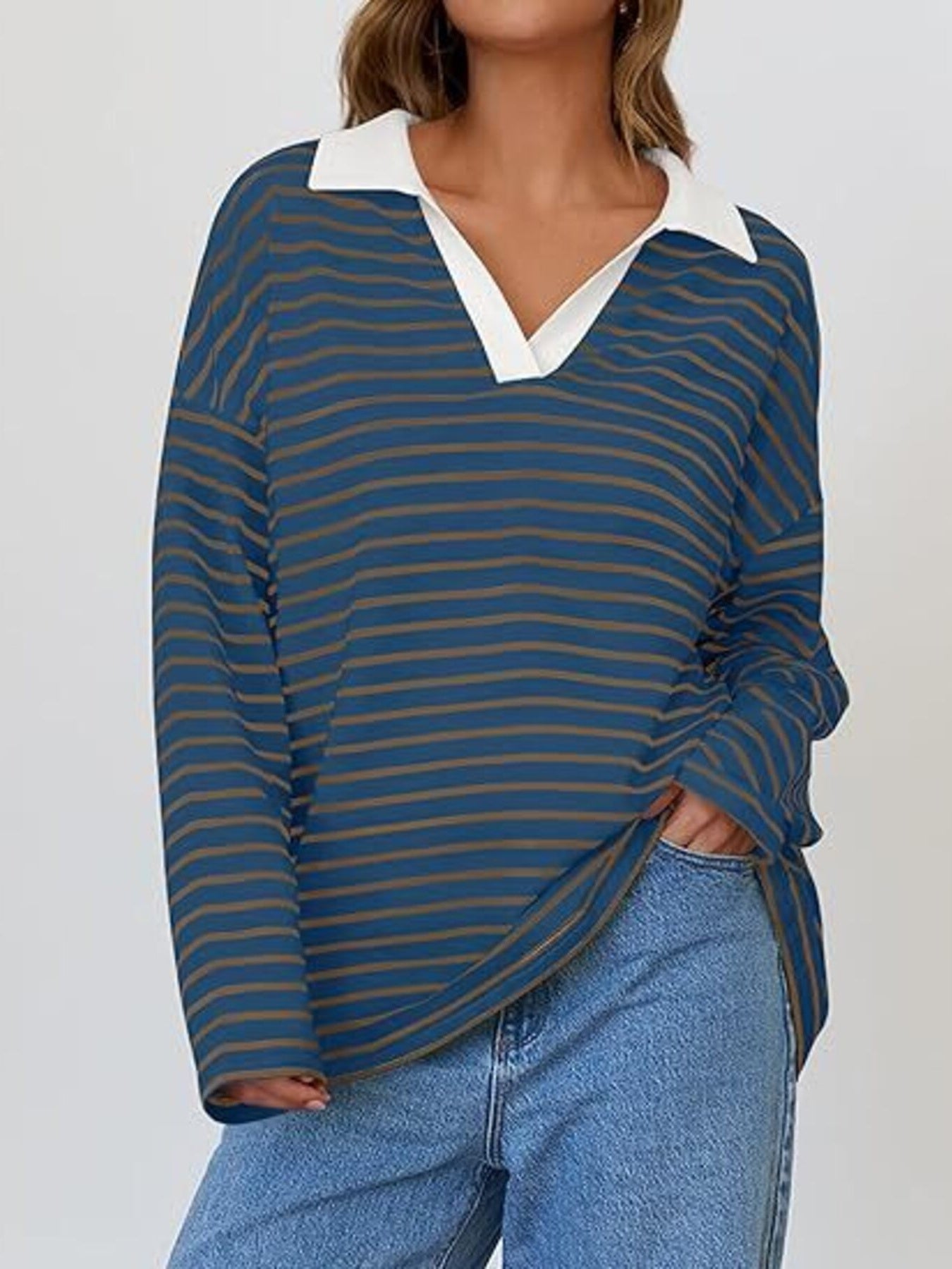 Oversized blue and brown striped long-sleeve sweatshirt with white collar and v-neck.