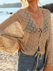 Apricot crochet knit beach cover-up with tie front and frayed bell sleeves.