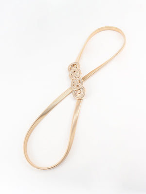 Gold elastic waist belt with intertwined knot detail