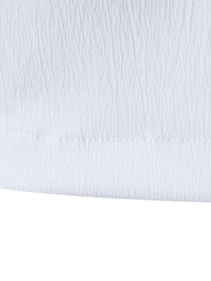 White cotton undershirt with textured fabric and visible stitching detail.