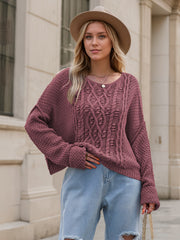 Mauve cable knit cocoon sweater with crew neck and relaxed fit.