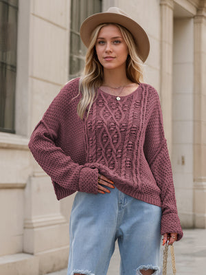 Mauve cable knit cocoon sweater with crew neck and relaxed fit.