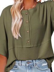 Green waffle-knit t-shirt with button detail and textured hem