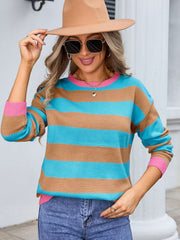 Striped acrylic sweater in caramel and turquoise with pink ribbed cuffs and neckline.