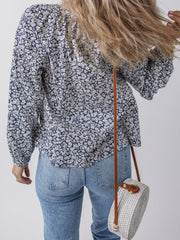 Bloomchic blouse with floral print, long sleeves, and a round neckline.