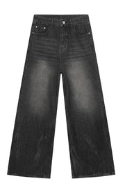 Dark balloon-leg denim jeans with a subtle fade and wide leg
