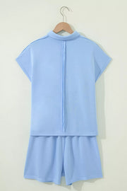 Light blue sleeveless polo shirt and shorts set with contrast stitching detail.