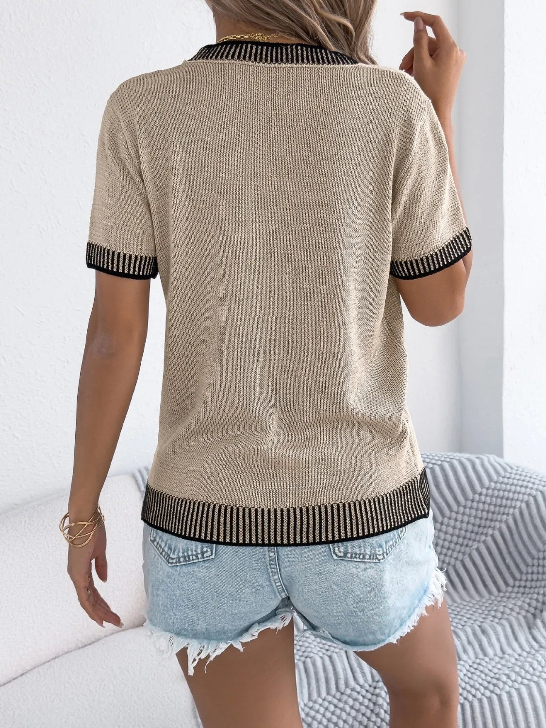 Khaki knit tee with contrast trim on collar, sleeves, and hem.