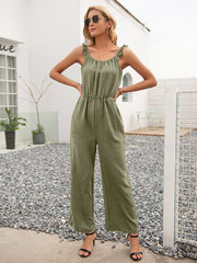 Matcha green textured wide-leg jumpsuit with ruffled straps and cinched waist.