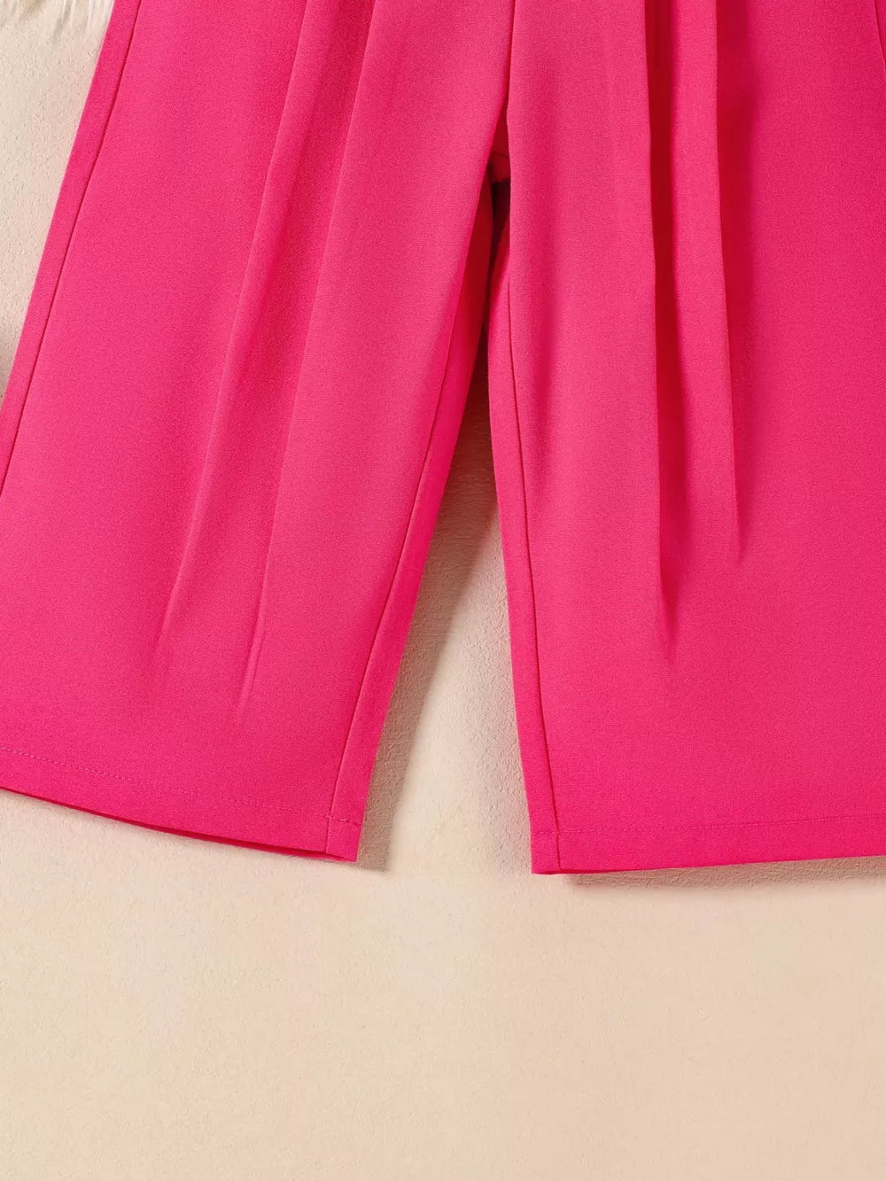 Chic two-piece set in Piece Red with pleated detail on pants.