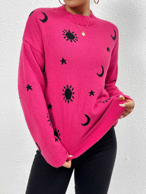 Hot pink drop shoulder knit sweater with black cosmic sun, moon, and star pattern.