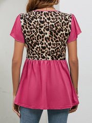Leopard panel peplum top in hot pink with short flutter sleeves and a gathered waist.