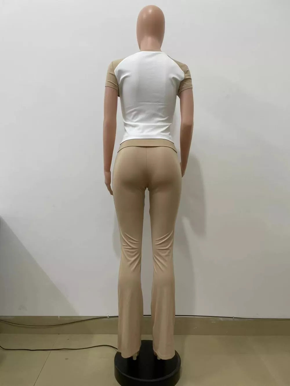 Chic contrast two-piece set: white & camel short sleeve tee with body-hugging flare pants.