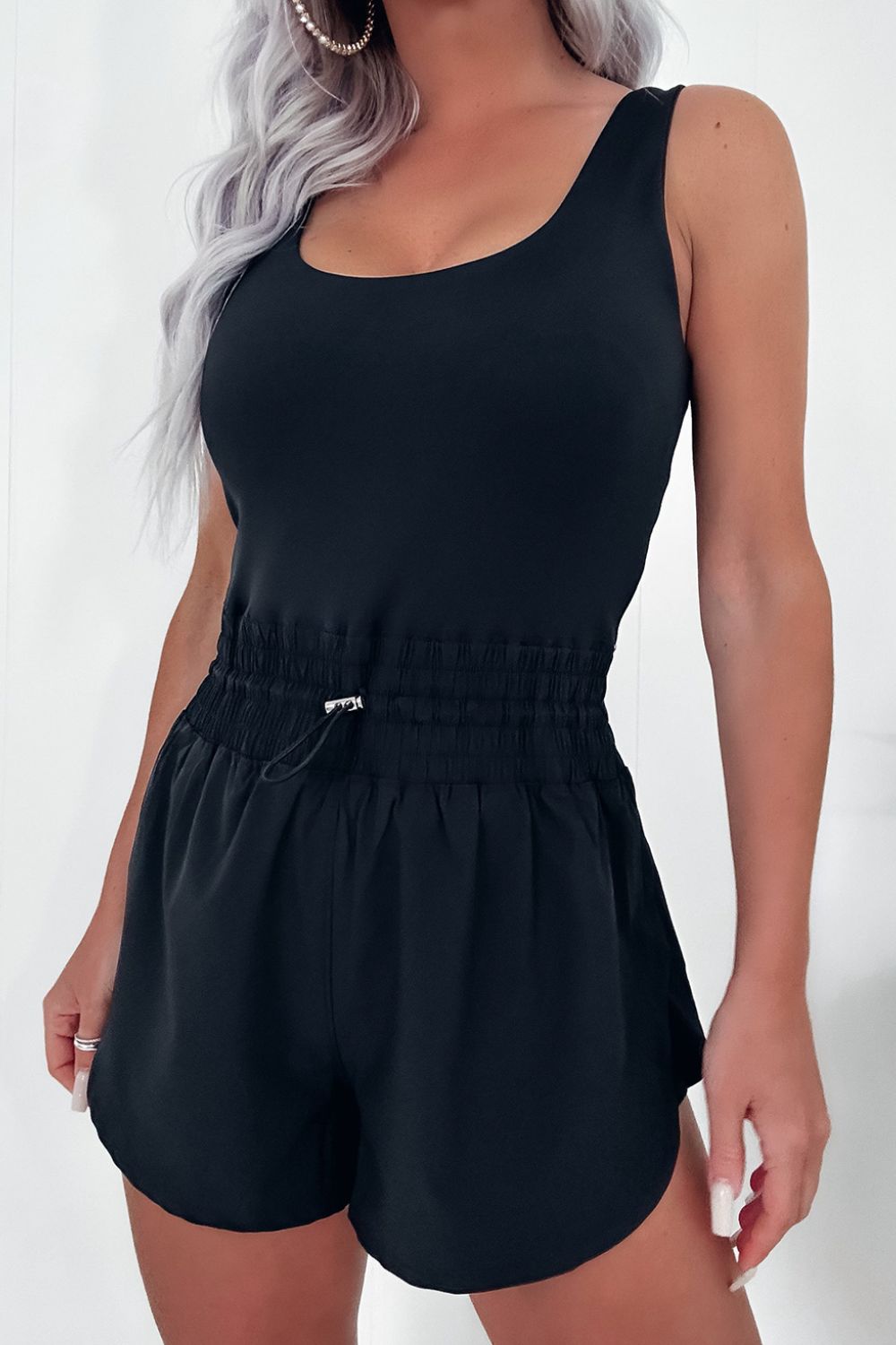 Black tank romper with gathered elastic waist and drawstring detail
