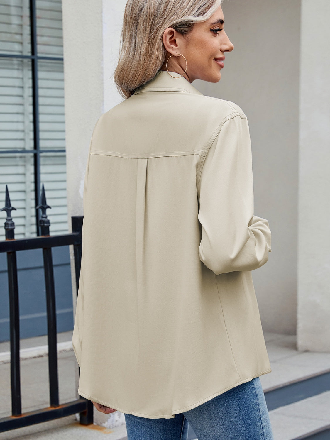 Beige utility crepe shirt with tie detail, long sleeves, and back pleat.
