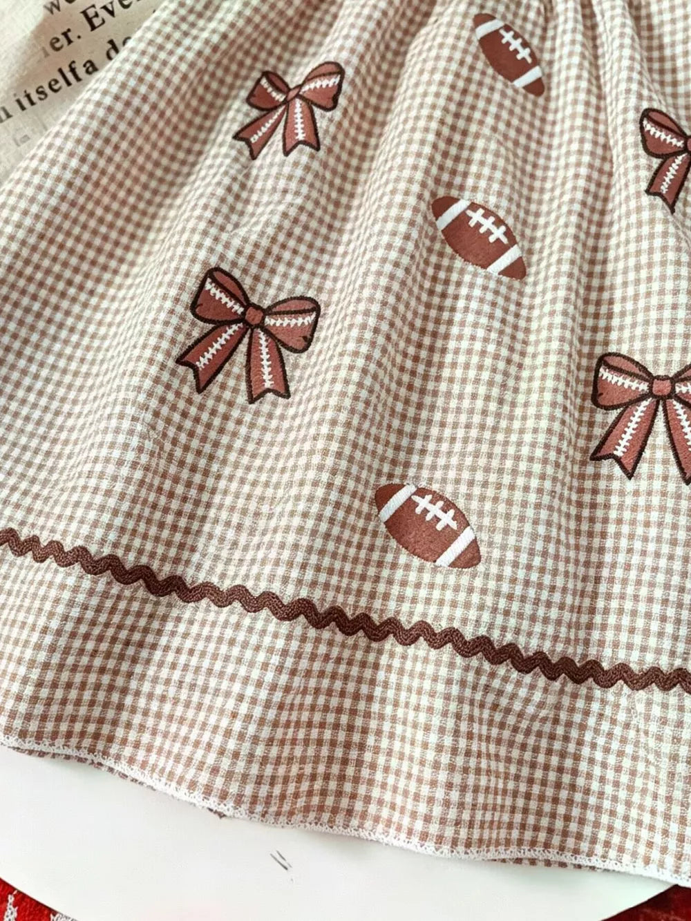Children's Gingham Football Puff Sleeve Dress in Brown, model styling view