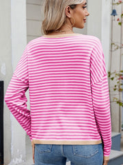 Pink and hot pink striped drop shoulder knit sweater with contrast trim.