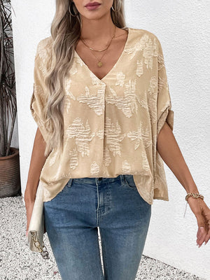 Tan textured floral blouson top with V-neck and short sleeves