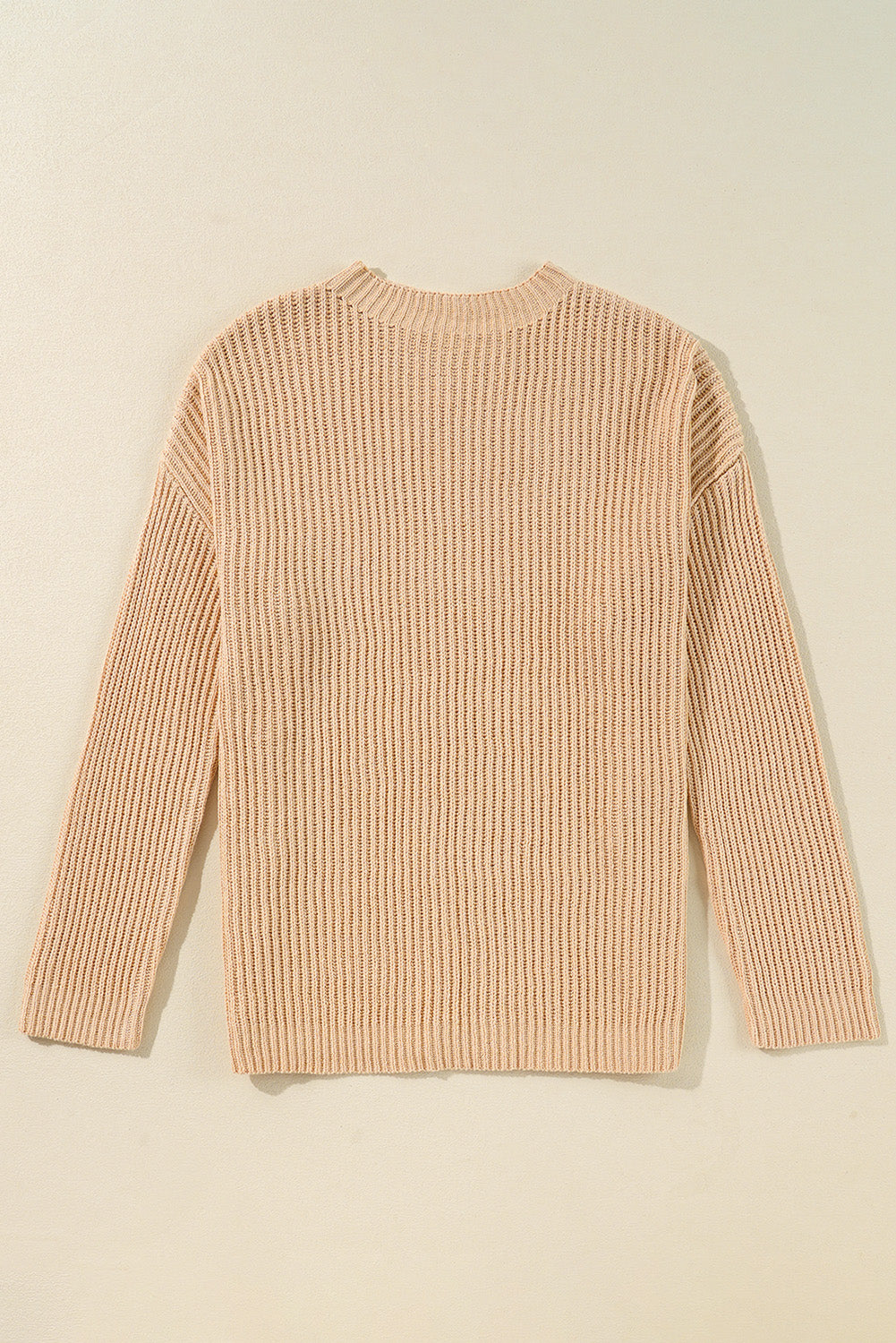 Tan ribbed knit pullover sweater with crew neck and long sleeves.
