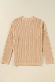 Tan ribbed knit pullover sweater with crew neck and long sleeves.