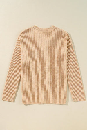 Tan ribbed knit pullover sweater with crew neck and long sleeves.