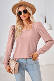 Blush pink diamond-textured puff sleeve top with square neckline.