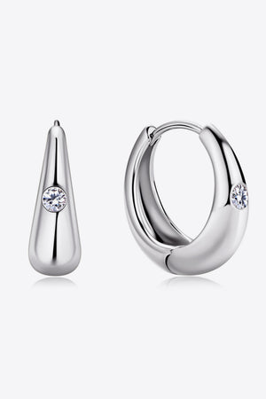 Silver hoop earrings and teardrop earrings with crystal accents, made of 925 sterling silver.