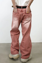 Relaxed fit coral denim jeans with a faded wash and wide leg.