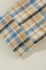 Textured plaid hooded overshirt with raw hem in plaid pattern.