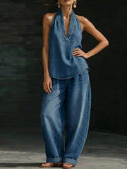 Blue denim halter neck top and wide-leg pants set with deep V-neck and cuffed ankles.