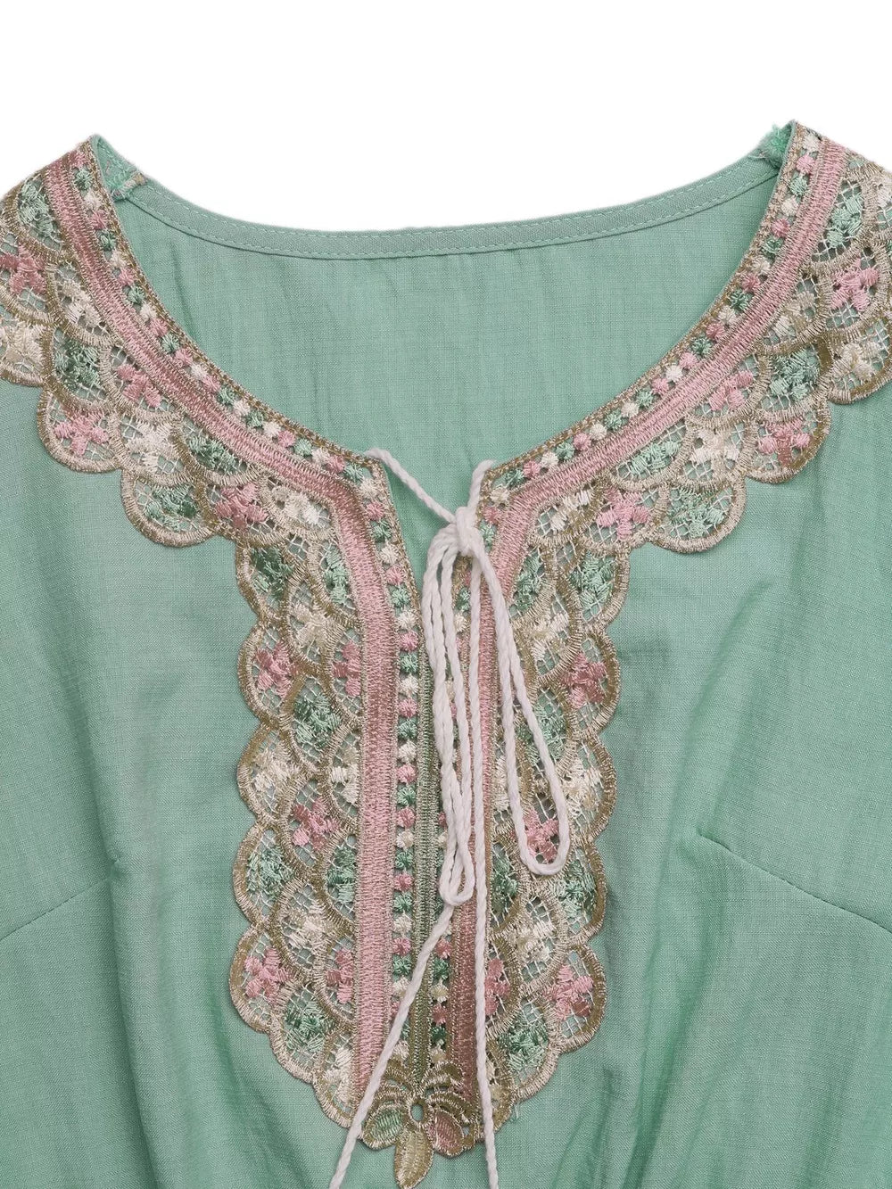 Mint green maternity maxi dress with embroidered tie neck and ruffled lace trim.