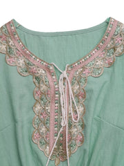 Mint green maternity maxi dress with embroidered tie neck and ruffled lace trim.