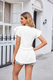 White flutter sleeve peplum blouse with ruffled hem detail