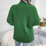 Green chunky knit dolman sleeve cardigan with a high neck and ribbed texture.