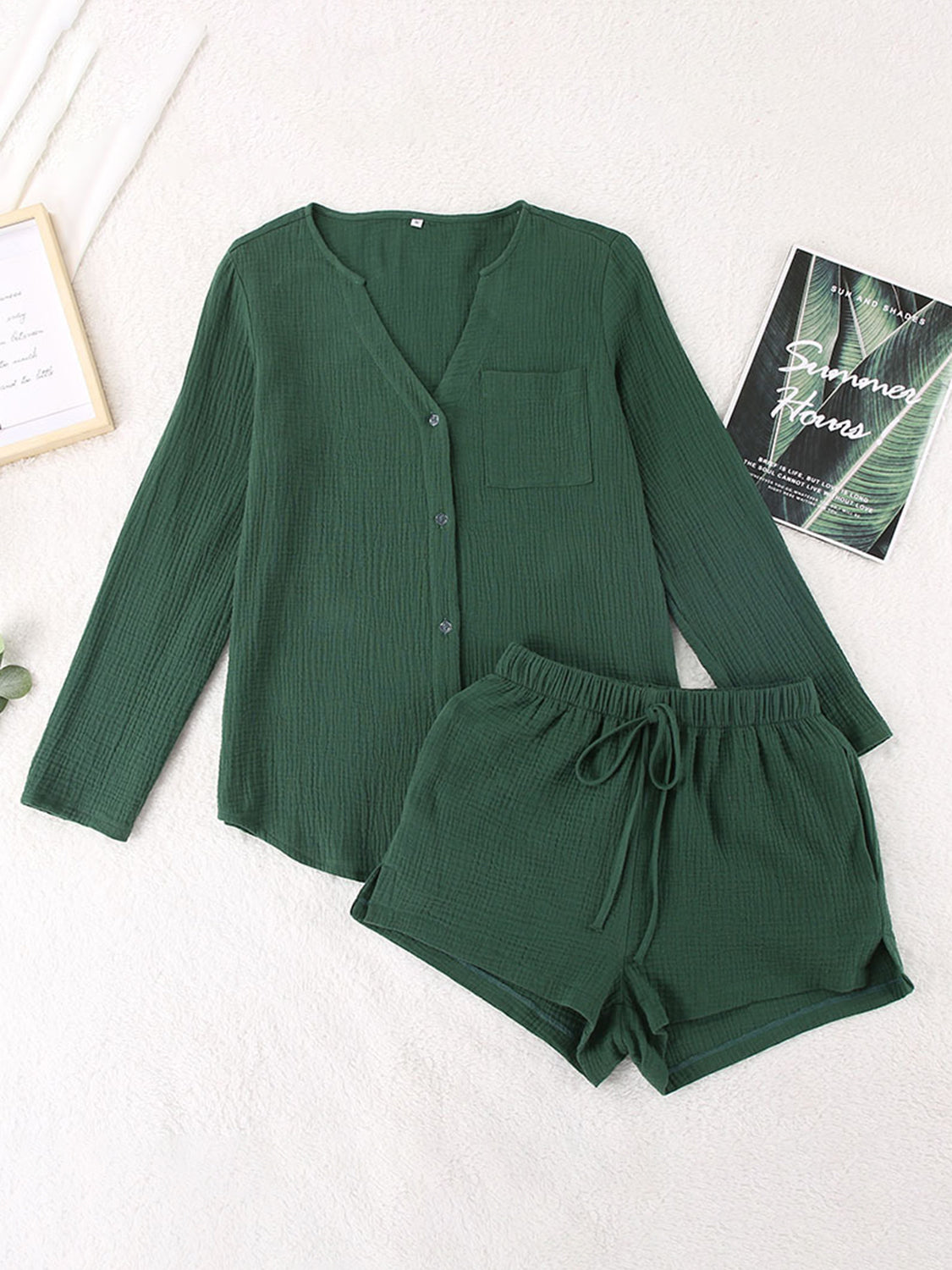 Textured cotton pajama set in dark green with button-up top and drawstring shorts.