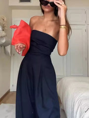 Dark blue strapless wide-leg maternity romper with a full skirt.