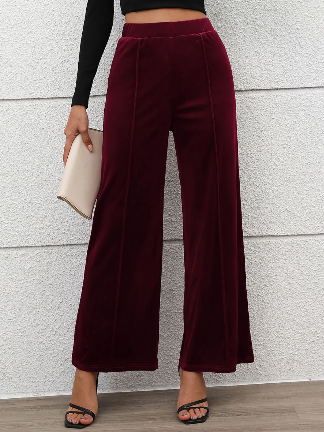 Burgundy velvet palazzo trousers with seam detail and wide leg