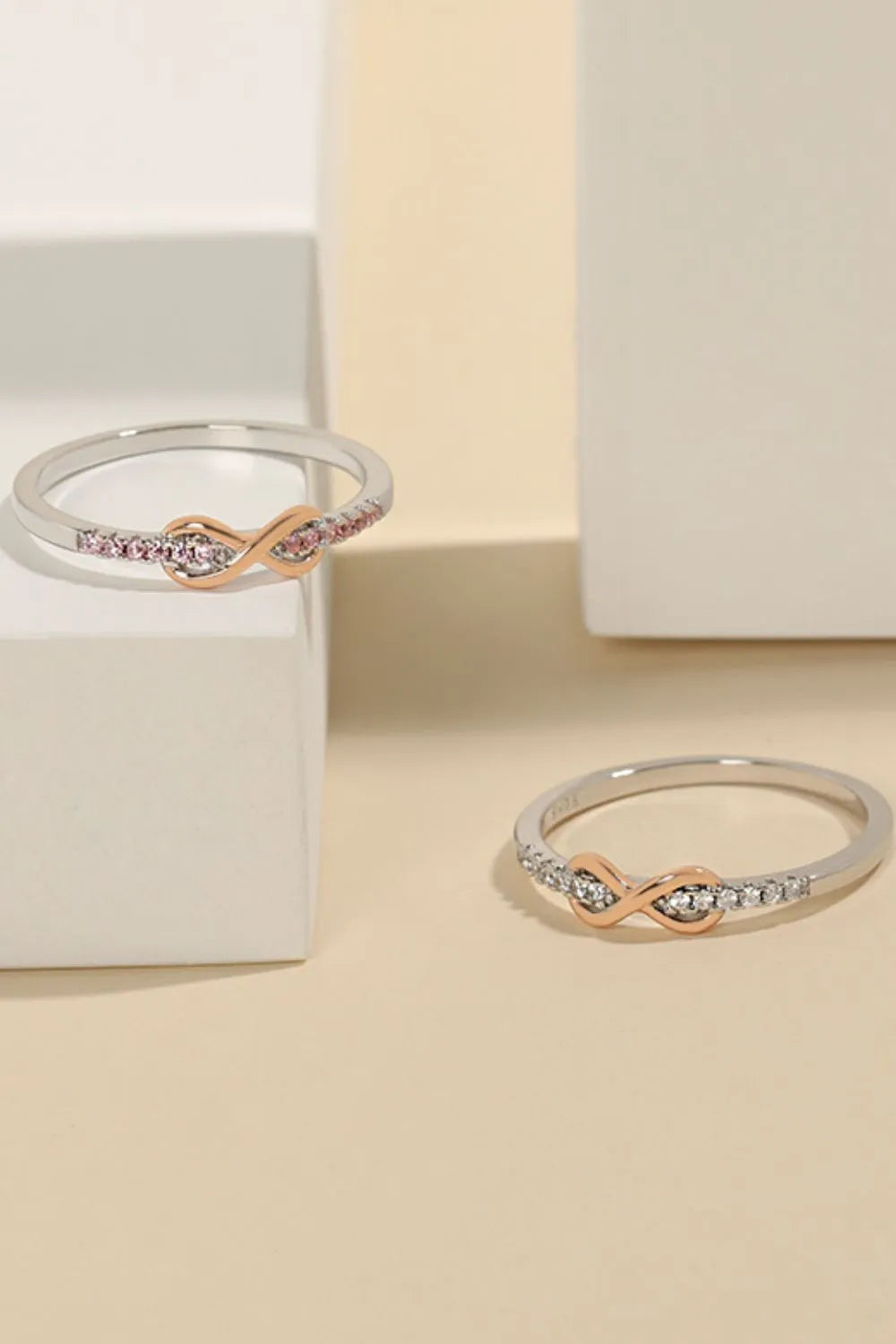 Eternity knot pavé ring in silver with rose gold accent and pink stones