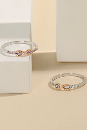 Eternity knot pavé ring in silver with rose gold accent and pink stones