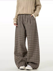 Plaid wide-leg sweatpants in brown with a relaxed fit and pleated front.