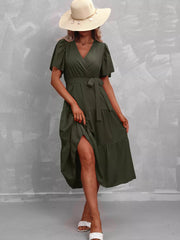 Dark green belted midi dress with flutter sleeves and tiered skirt.