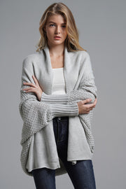 Light gray acrylic cocoon knit sleeve cardigan with open front and textured sleeves.