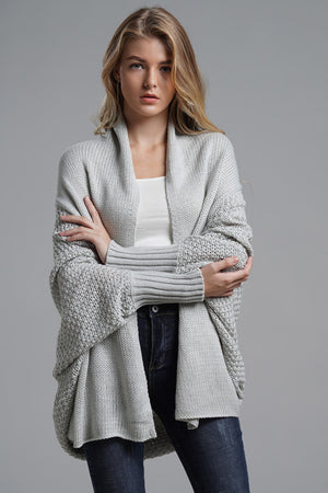 Light gray acrylic cocoon knit sleeve cardigan with open front and textured sleeves.
