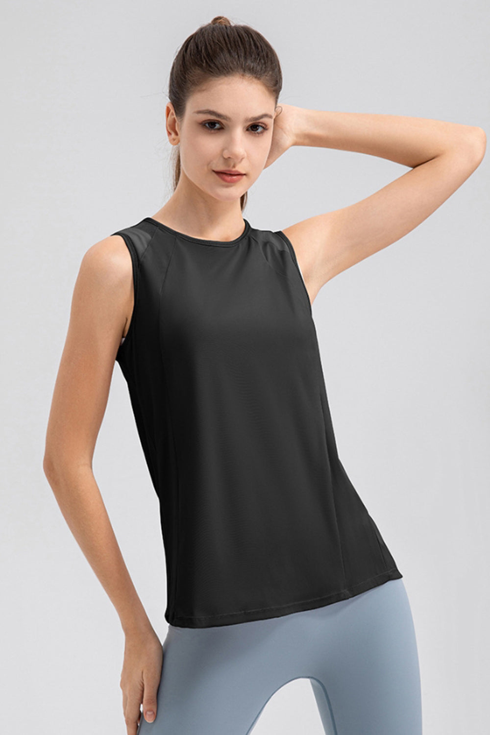 Black mesh panel performance tank top with a round neckline and sleeveless design.