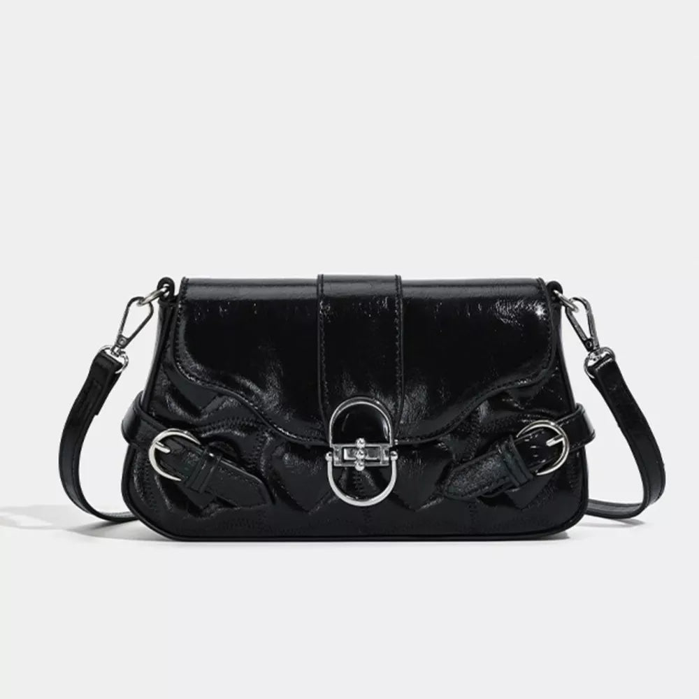 Black heart-quilted crossbody bag with buckle accent and silver hardware.