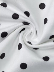 White polyester cami with black polka dots and a soft texture.