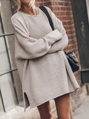 Oversized beige open-knit sweater dress with crew neck and side slits