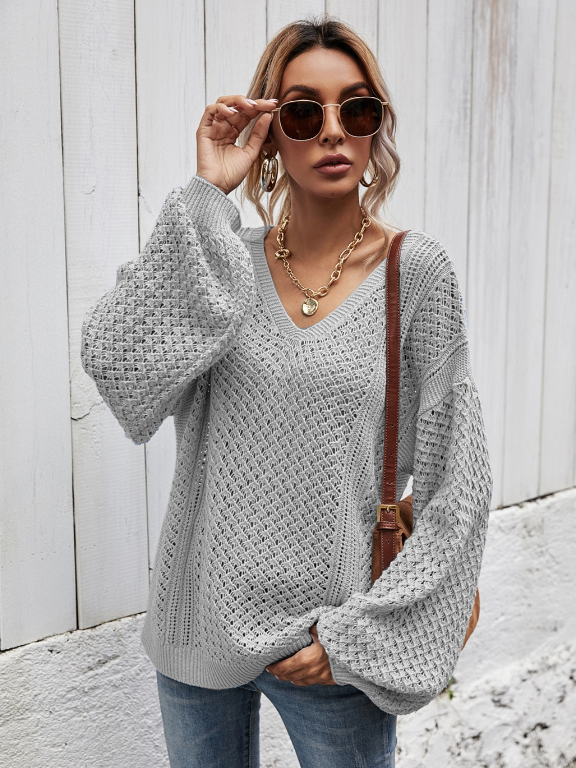 Light Gray open-knit sweater with V-neck and balloon sleeves.