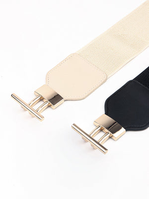 Elastic waist belts in black and cream with gold hardware buckles