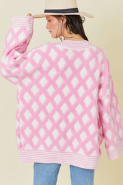 Diamond jacquard knit open cardigan in blush pink with a relaxed fit and ribbed trim.